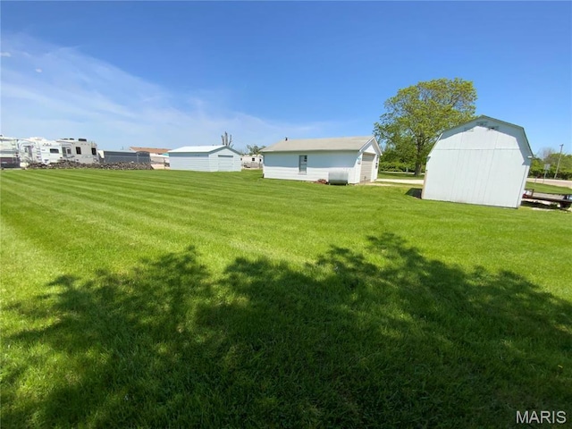 401 Edinger Rd, Wentzville, MO 63385 - view of green lawn featuring an outbuilding