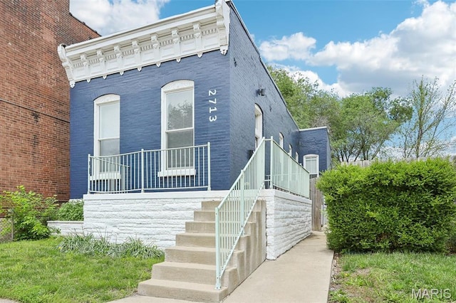 2713 Utah St, Saint Louis, MO 63118 - view of front of home featuring stairway and brick siding