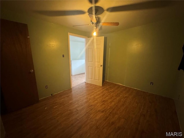 2442 Adams St, Granite City, IL 62040 - empty room with a ceiling fan and wood finished floors