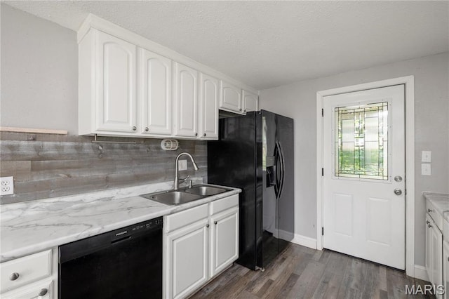 400 Main St, Waynesville, MO 65583 - kitchen featuring black appliances, a sink, tasteful backsplash, dark wood finished floors, and white cabinetry