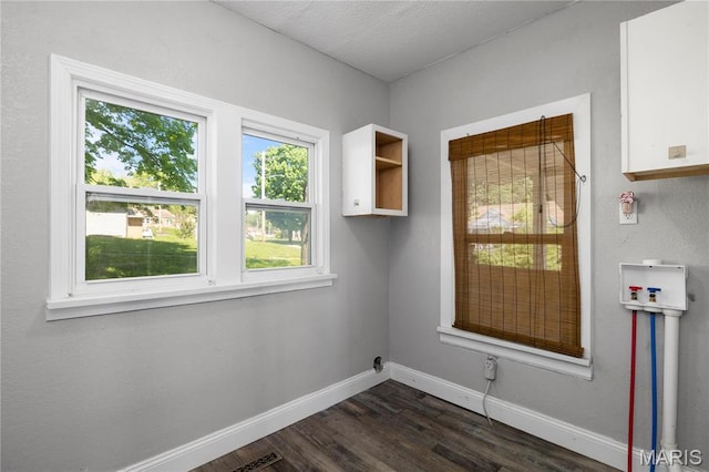 400 Main St, Waynesville, MO 65583 - unfurnished dining area featuring baseboards and dark wood-type flooring
