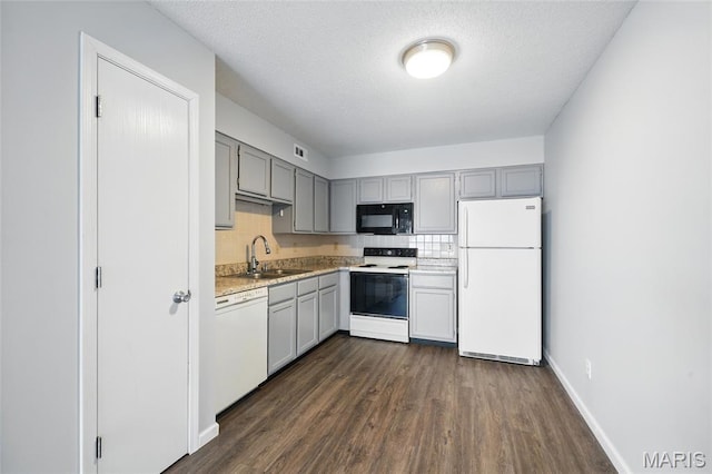 9 Berview Cir Unit H, Saint Louis, MO 63129 - kitchen featuring white appliances, a sink, gray cabinetry, dark wood-style floors, and light countertops