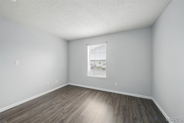 9 Berview Cir Unit H, Saint Louis, MO 63129 - spare room featuring dark wood finished floors, baseboards, and a textured ceiling