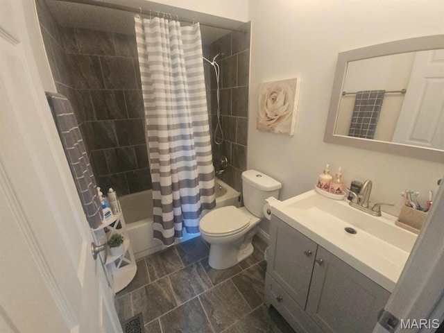 bathroom with shower / bathtub combination with curtain, toilet, and vanity