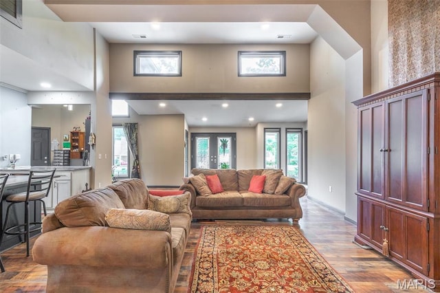 732 N Main St, Poplar Bluff, MO 63901 - living area with a high ceiling, wood finished floors, recessed lighting, and baseboards