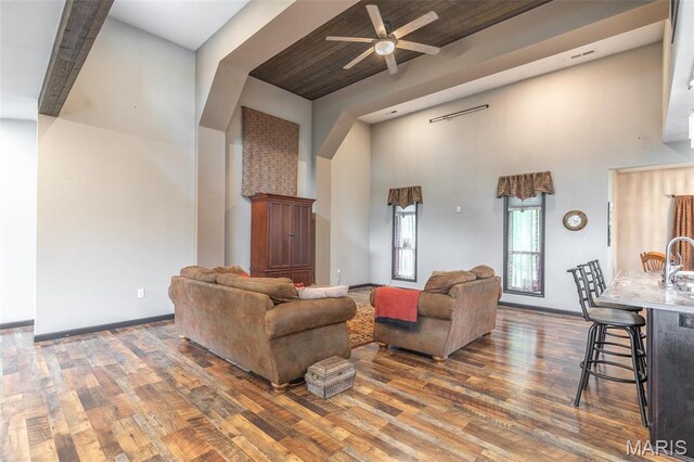 732 N Main St, Poplar Bluff, MO 63901 - living room with a high ceiling, wood finished floors, a ceiling fan, and baseboards