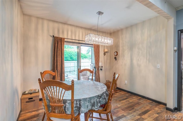 732 N Main St, Poplar Bluff, MO 63901 - dining area with wood finished floors, a chandelier, and baseboards