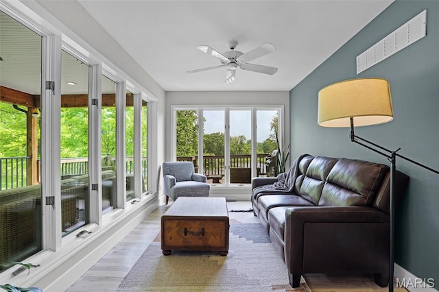 sunroom / solarium with wood finished floors