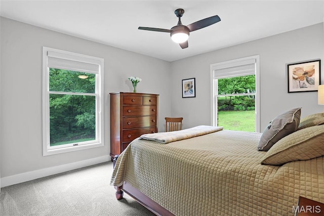 bedroom featuring carpet floors, baseboards, and ceiling fan