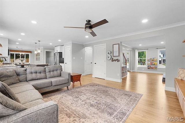 66 Walnutshade Ct, Saint Peters, MO 63376 - living area with ornamental molding, ceiling fan, recessed lighting, and light wood-style floors