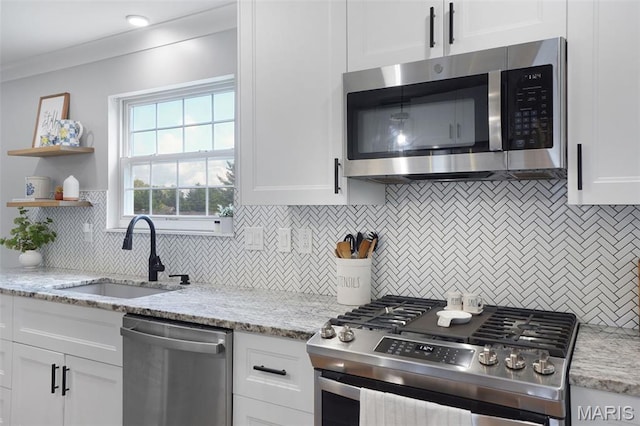 66 Walnutshade Ct, Saint Peters, MO 63376 - kitchen featuring appliances with stainless steel finishes, tasteful backsplash, white cabinetry, and light stone counters