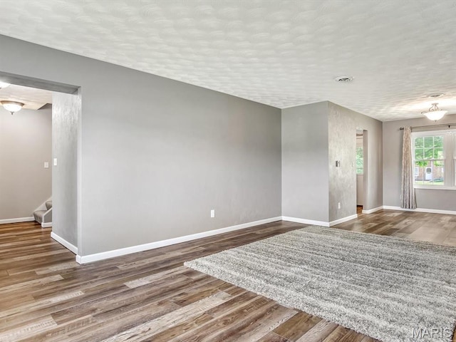 605 S Ridge Ave, Steeleville, IL 62288 - spare room featuring wood finished floors, baseboards, and stairs