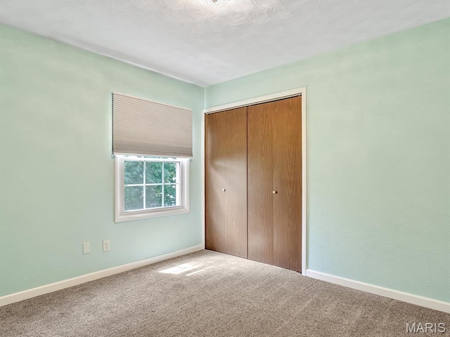605 S Ridge Ave, Steeleville, IL 62288 - unfurnished bedroom with carpet floors, a closet, and baseboards