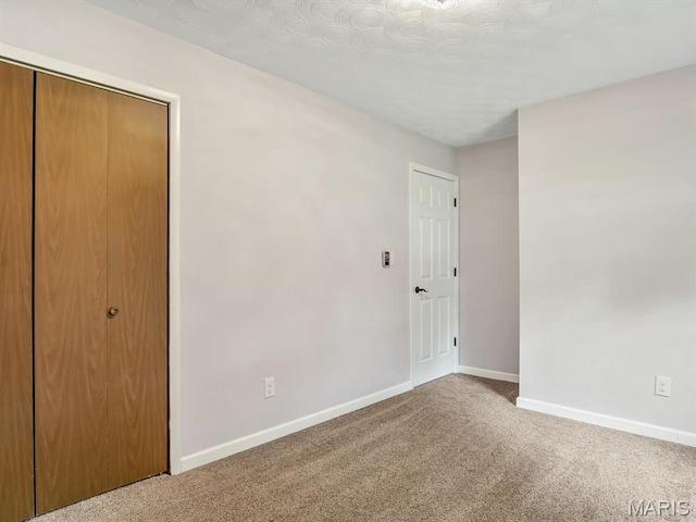 605 S Ridge Ave, Steeleville, IL 62288 - unfurnished bedroom featuring baseboards, carpet, and a closet