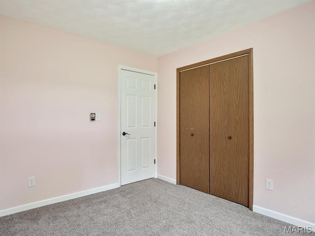 605 S Ridge Ave, Steeleville, IL 62288 - unfurnished bedroom with carpet flooring, baseboards, and a closet