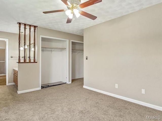 605 S Ridge Ave, Steeleville, IL 62288 - unfurnished bedroom featuring light colored carpet, baseboards, two closets, and connected bathroom