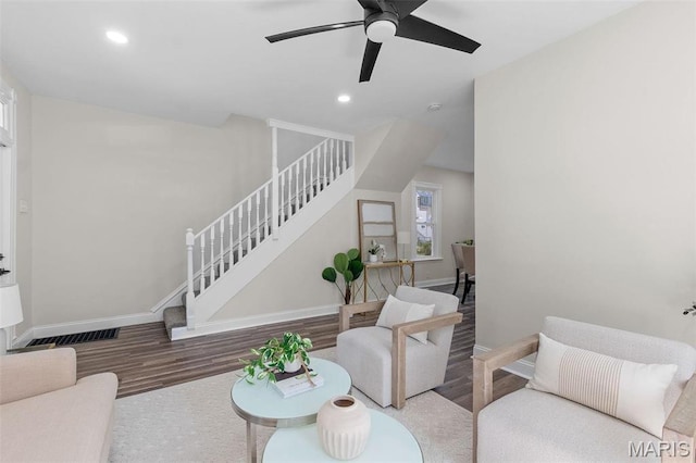 7211 Kensington Ave, Maplewood, MO 63143 - living area featuring wood finished floors, stairway, baseboards, ceiling fan, and recessed lighting