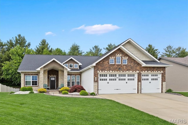 409 Briar Creek Rd, Troy, IL 62294 - craftsman-style home featuring a garage, stone siding, and driveway