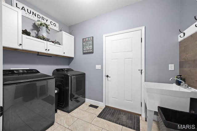 409 Briar Creek Rd, Troy, IL 62294 - washroom featuring cabinet space, washer and dryer, light tile patterned floors, and baseboards