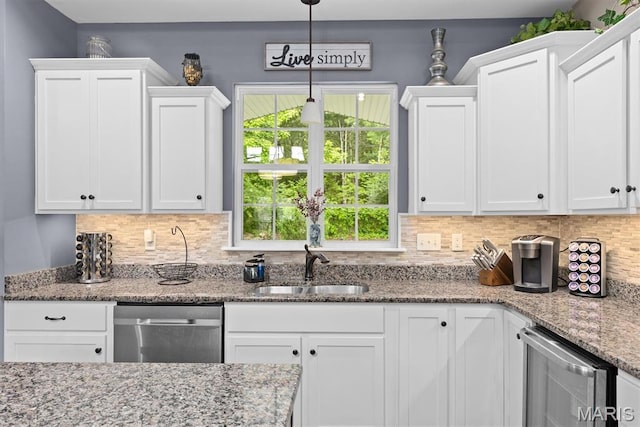 409 Briar Creek Rd, Troy, IL 62294 - kitchen featuring a sink, dishwasher, white cabinetry, tasteful backsplash, and light stone countertops