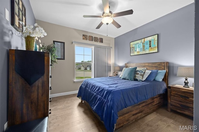 409 Briar Creek Rd, Troy, IL 62294 - bedroom featuring wood finished floors, baseboards, and a ceiling fan