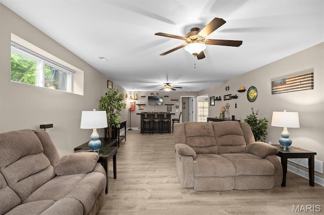 409 Briar Creek Rd, Troy, IL 62294 - living room featuring plenty of natural light, ceiling fan, light wood-type flooring, and baseboards