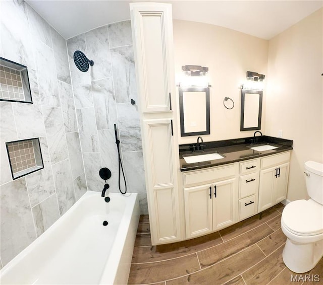 906 E Pace St, Salem, MO 65560 - full bathroom featuring wood finish floors, toilet, bathing tub / shower combination, and double vanity
