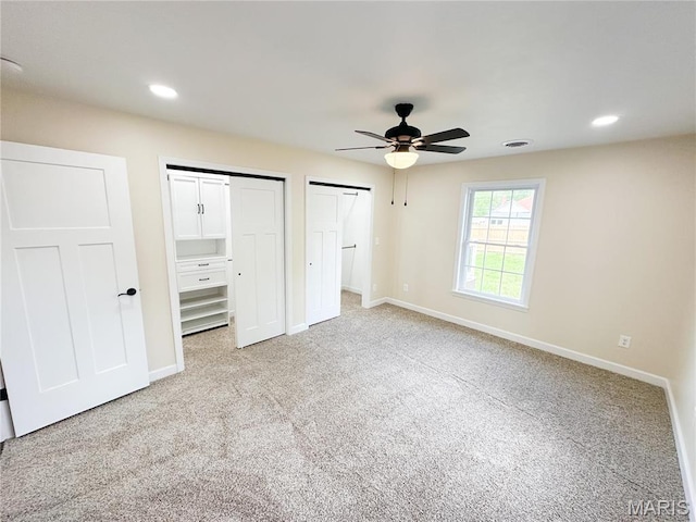 906 E Pace St, Salem, MO 65560 - unfurnished bedroom featuring multiple closets, carpet, baseboards, and recessed lighting