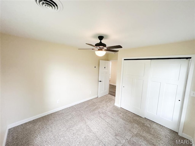 906 E Pace St, Salem, MO 65560 - unfurnished bedroom featuring carpet, a closet, baseboards, and a ceiling fan