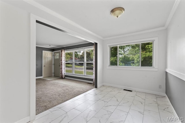 1095 Rogers Ln, Florissant, MO 63033 - unfurnished room with healthy amount of natural light, light marble finish flooring, crown molding, and baseboards