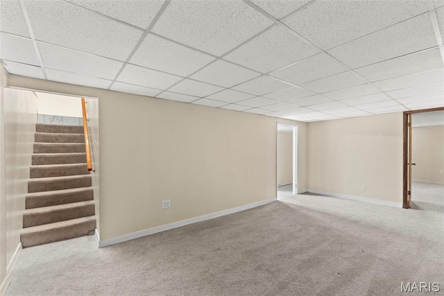 1095 Rogers Ln, Florissant, MO 63033 - finished below grade area featuring carpet flooring, stairway, a drop ceiling, and baseboards