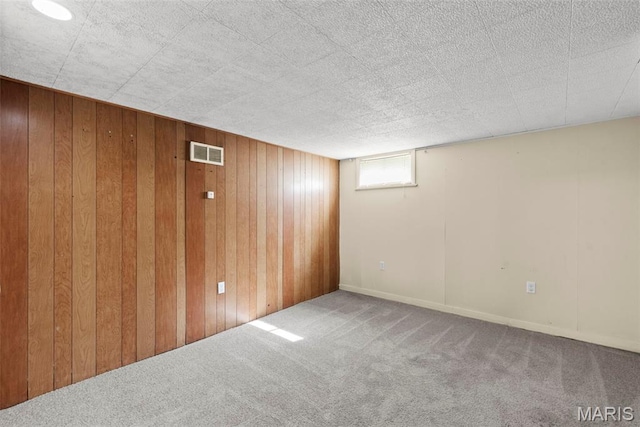 1095 Rogers Ln, Florissant, MO 63033 - below grade area featuring carpet and wooden walls