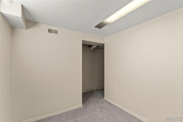 1095 Rogers Ln, Florissant, MO 63033 - unfurnished bedroom with light carpet and baseboards