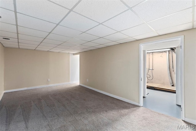 1095 Rogers Ln, Florissant, MO 63033 - spare room with carpet floors, baseboards, and a drop ceiling