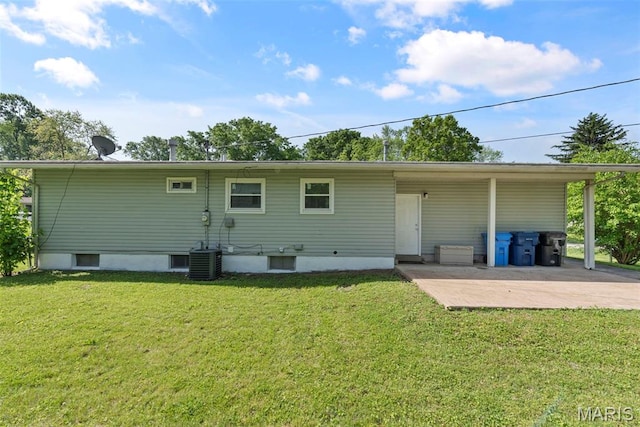1095 Rogers Ln, Florissant, MO 63033 - back of house with a yard, central AC unit, and a patio