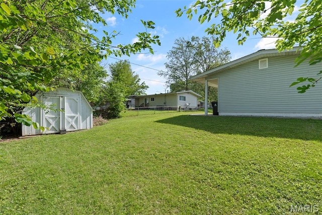 1095 Rogers Ln, Florissant, MO 63033 - view of yard featuring a storage shed and an outbuilding