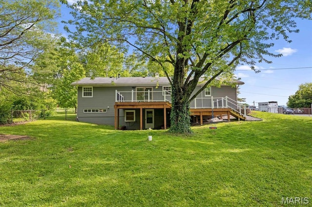 back of house featuring a wooden deck and stairway
