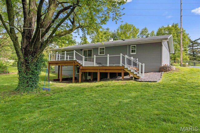 rear view of house with stairway and a deck