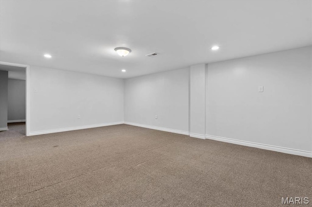 below grade area with carpet flooring, recessed lighting, and baseboards