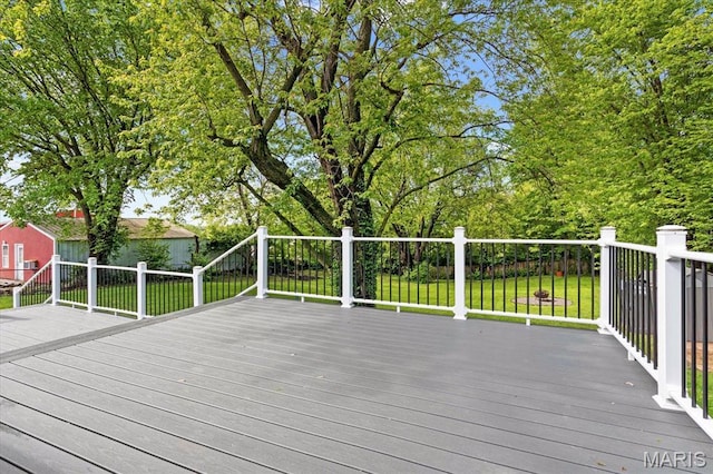 wooden terrace with a yard