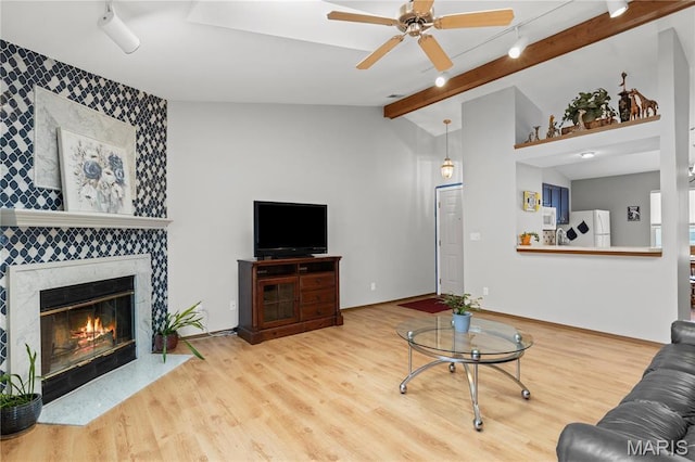51 Sugar Ridge Ct, Saint Peters, MO 63376 - living room featuring ceiling fan, wood finished floors, an accent wall, and a fireplace
