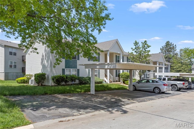 51 Sugar Ridge Ct, Saint Peters, MO 63376 - view of building exterior with covered and uncovered parking and stairway