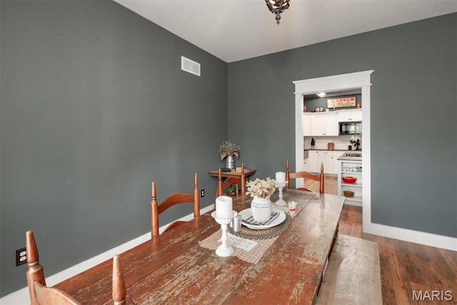 7877 Sylvan Pl, Dittmer, MO 63023 - dining room with wood finished floors and baseboards
