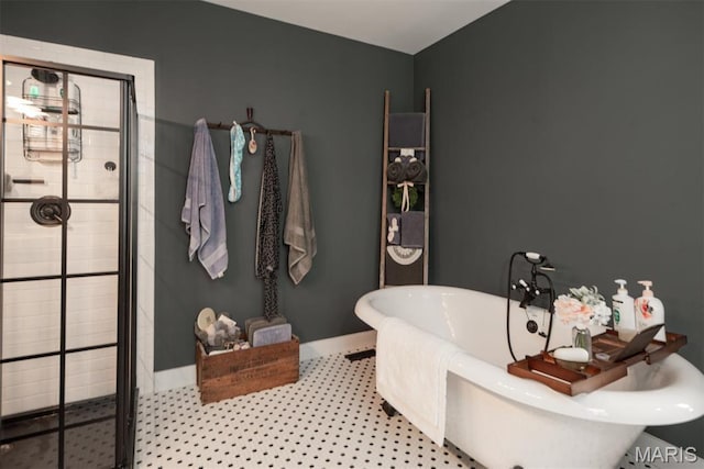 7877 Sylvan Pl, Dittmer, MO 63023 - bathroom featuring a stall shower, a soaking tub, and baseboards