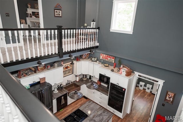 7877 Sylvan Pl, Dittmer, MO 63023 - stairway featuring wood finished floors