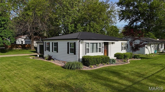 view of side of home featuring metal roof
