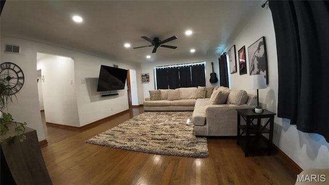 living area featuring a ceiling fan, baseboards, recessed lighting, and dark wood-style flooring