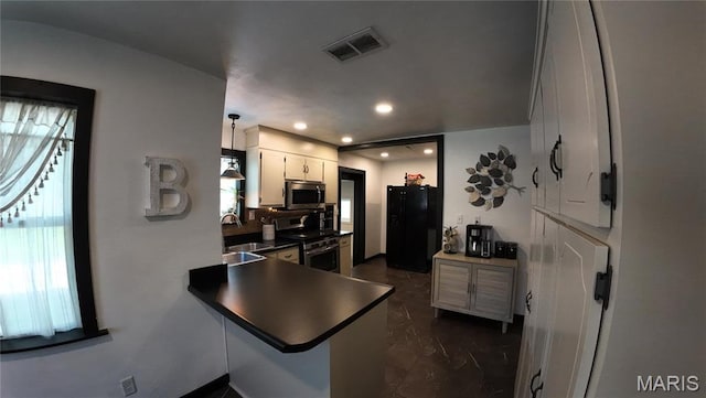 kitchen with stainless steel appliances, a sink, dark countertops, recessed lighting, and decorative backsplash