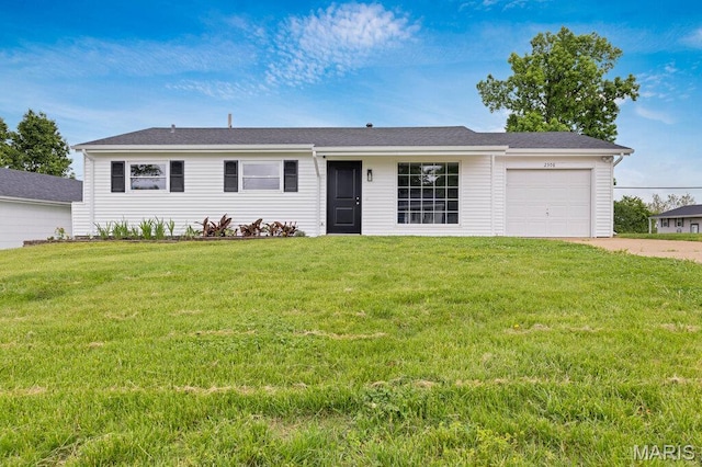 single story home with an attached garage, driveway, and a front yard