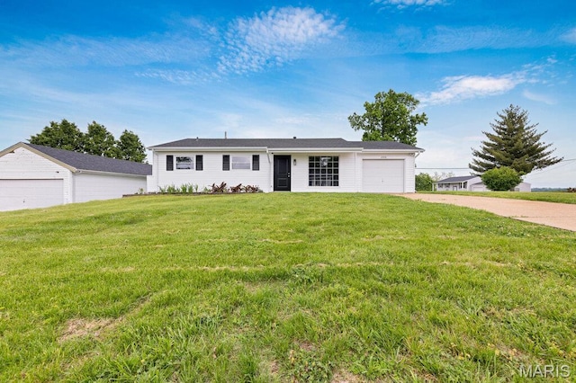 ranch-style home featuring concrete driveway, an attached garage, and a front lawn